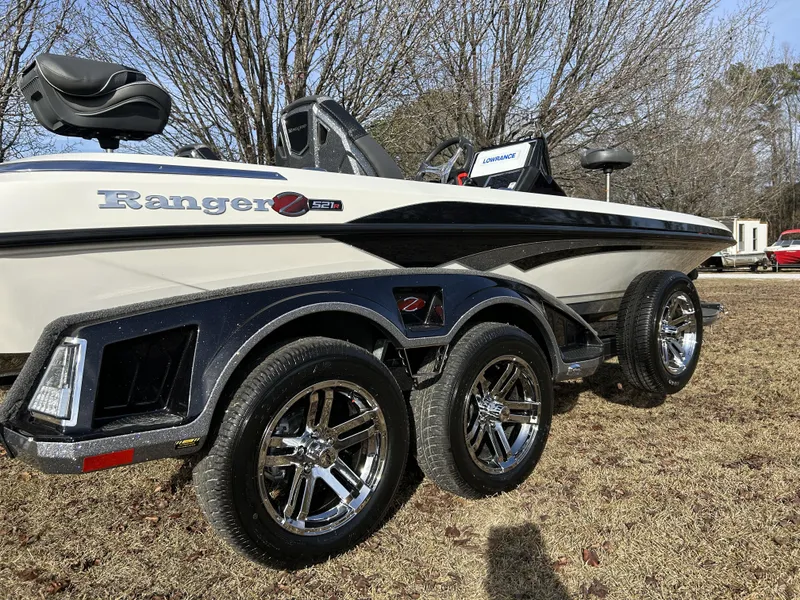Slide: The Image of 2024 Ranger Z521R Ranger Cup Equipped boat on a trailer with chrome wheels. - 4