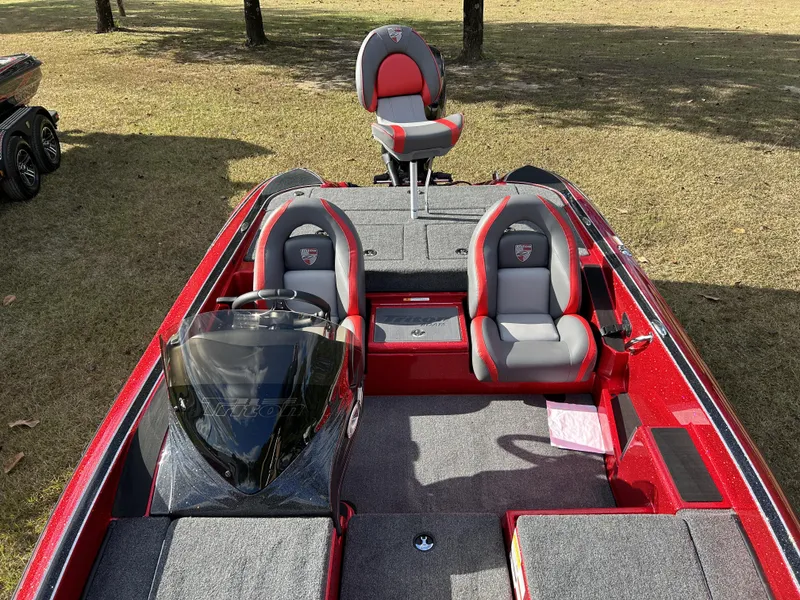 Slide: The Image of 2024 Triton 179 TrX bass boat with red and gray seating. - 13