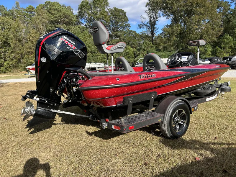 Slide: The Image of 2024 Triton 179 TrX bass boat with Mercury Pro XS engine on trailer. - 3