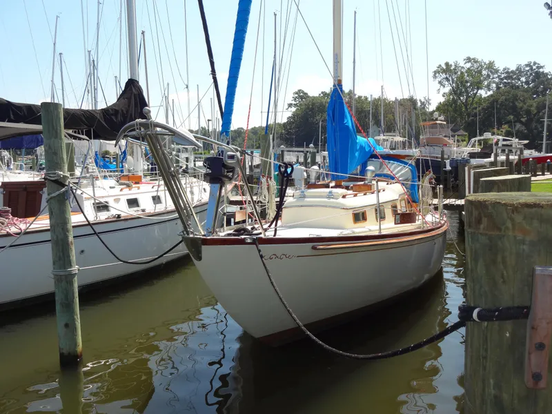 Slide: The Image of 1966 Cheoy Lee 36 Offshore Flying Buffalo sailboat docked at marina. - 1