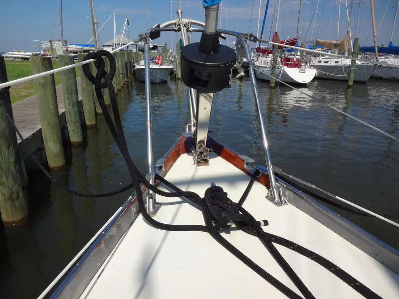 Slide: The Image of Bow view of 1966 Cheoy Lee 36 Offshore Flying Buffalo docked at marina. - 12