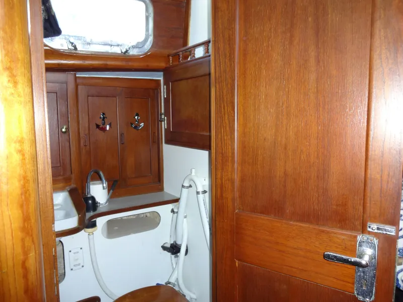 Slide: The Image of Wooden interior of 1966 Cheoy Lee 36 Offshore Flying Buffalo yacht bathroom. - 32