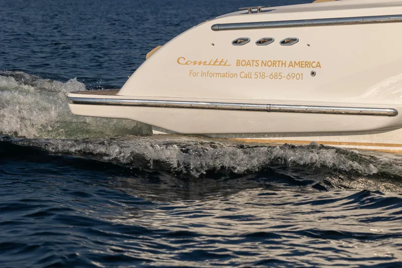 Slide: The Image of 2022 Comitti ISOLA 33 Sport SD boat cruising on water. - 12