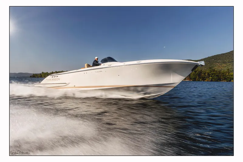 Slide: The Image of 2022 Comitti ISOLA 33 Sport SD speeding on a lake. - 2