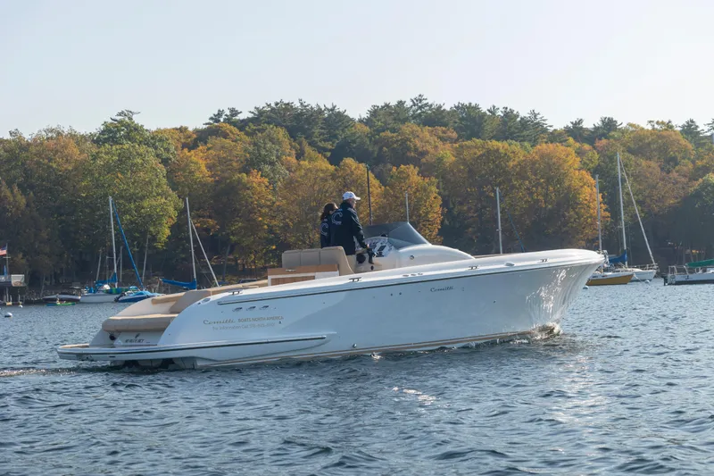 Slide: The Image of 2022 Comitti ISOLA 33 Sport SD cruising on a lake with autumn foliage in the background. - 22