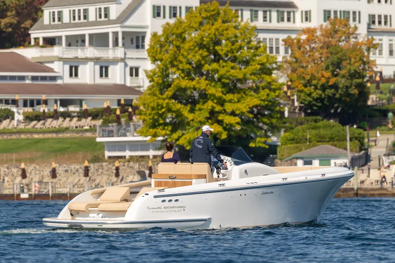 Slide: The Image of 2022 Comitti ISOLA 33 Sport SD boat cruising near waterfront homes. - 42