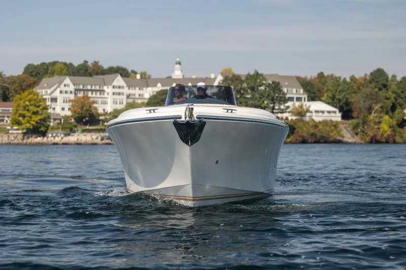 Slide: The Image of 2022 Comitti ISOLA 33 Sport SD boat cruising on a scenic lake. - 45