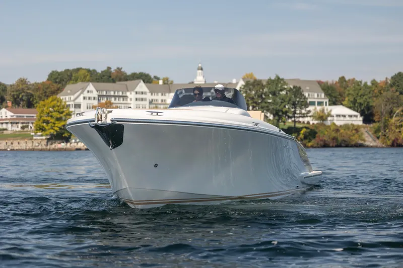 Slide: The Image of 2022 Comitti ISOLA 33 Sport SD boat cruising on a scenic lake. - 47