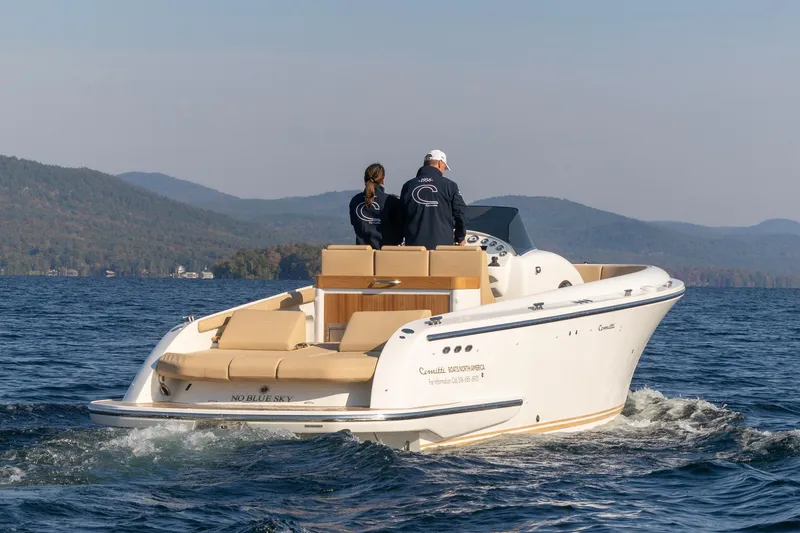 Slide: The Image of 2022 Comitti ISOLA 33 Sport SD cruising on a lake with two passengers. - 5