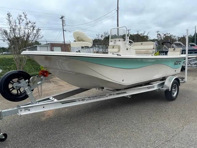 Slide: The Image of 2024 Carolina Skiff 19LS boat on a trailer, side view. - 1