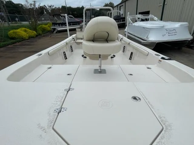 Slide: The Image of 2024 Carolina Skiff 19LS boat interior with seating and storage compartments. - 2