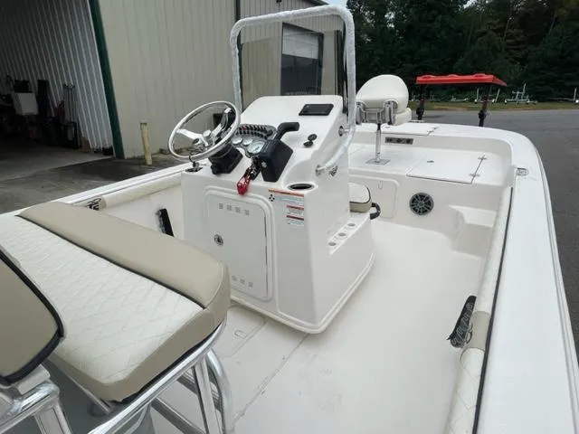 Slide: The Image of 2024 Carolina Skiff 19LS boat interior with steering console and seating. - 5