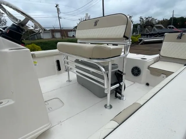 Slide: The Image of 2024 Carolina Skiff 19LS boat interior with seating and steering console. - 9