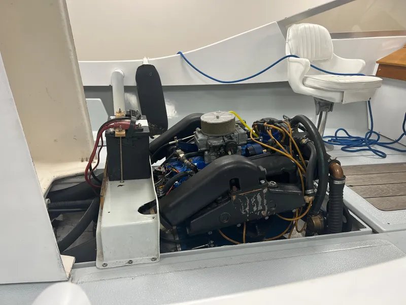 Slide: The Image of 1983 Shamrock 200 Open boat interior with steering wheel and white seats. - 4