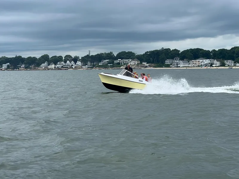 Slide: The Image of 1983 Shamrock 200 Open boat engine compartment with visible wiring and components. - 5