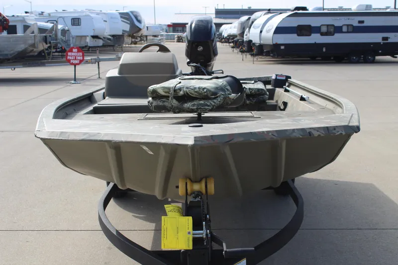 The Image of 2024 Tracker Grizzly 1754 SC boat on trailer, parked in an RV dealership lot. - 0