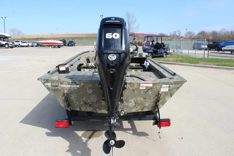 Slide: The Image of 2024 Tracker Grizzly 1754 SC boat with Mercury 60 outboard motor, rear view. - 5