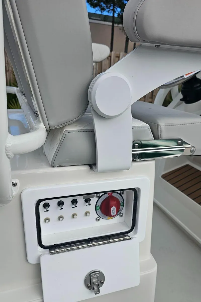 Slide: The Image of 2024 Ranger 2510 Bay boat control panel and seating. - 10