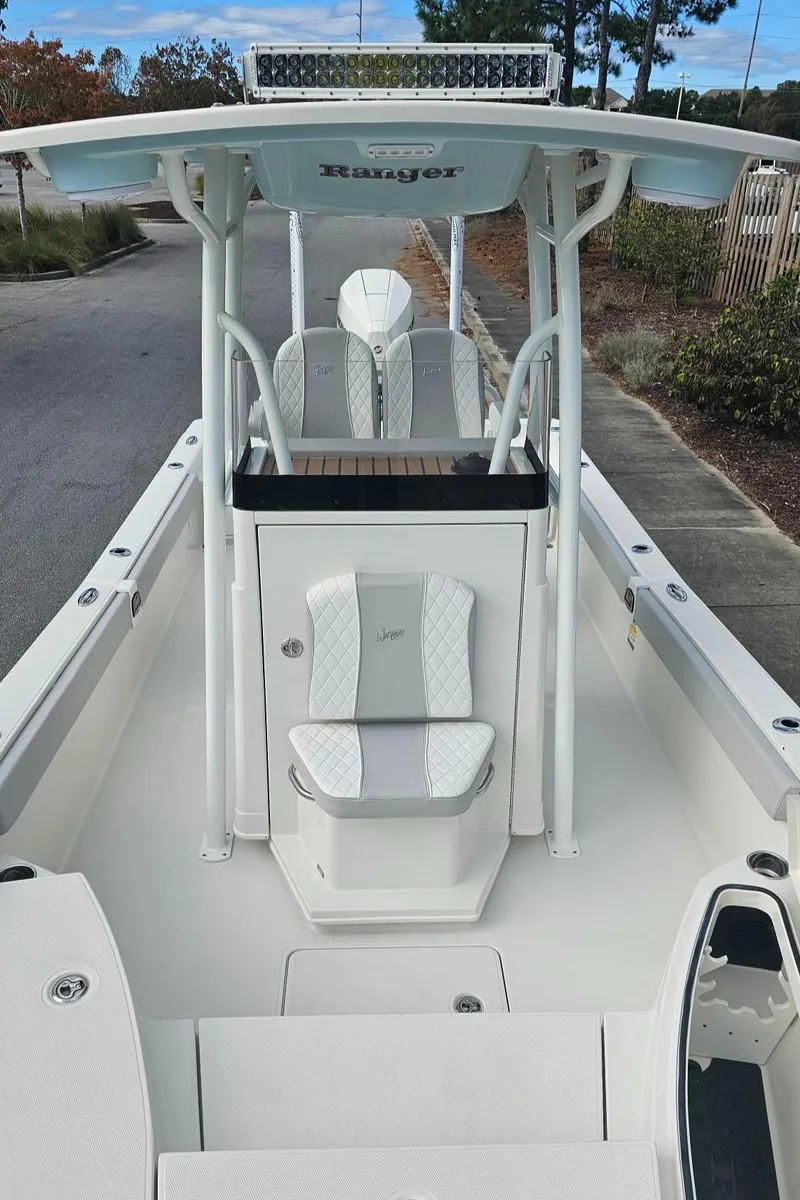 Slide: The Image of 2024 Ranger 2510 Bay boat with white interior and center console. - 14