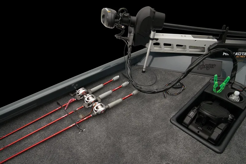 Slide: The Image of 2024 Ranger RT188 boat deck with fishing rods and trolling motor. - 33