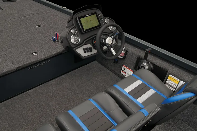 Slide: The Image of 2024 Ranger RT188 boat interior with steering wheel, dashboard, and cushioned seats. - 42
