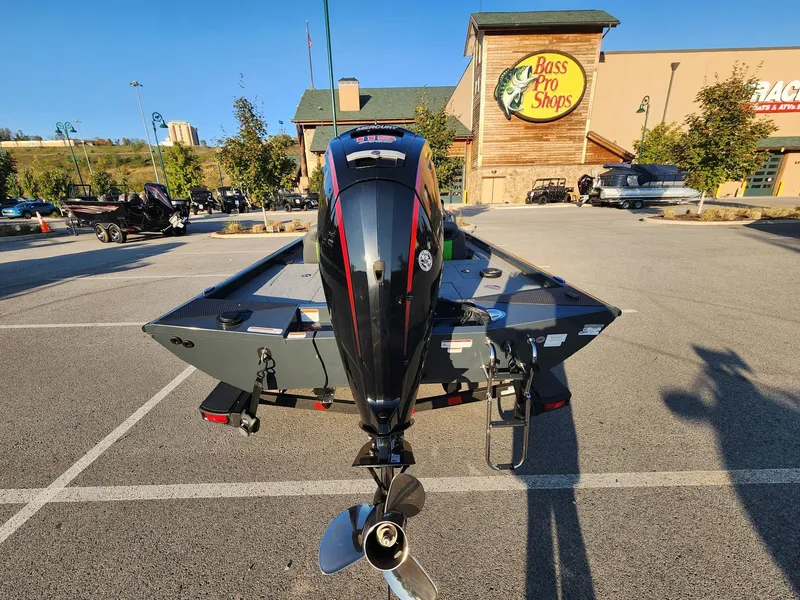 Slide: The Image of 2024 Ranger RT188 boat parked at Bass Pro Shops with outboard motor. - 5