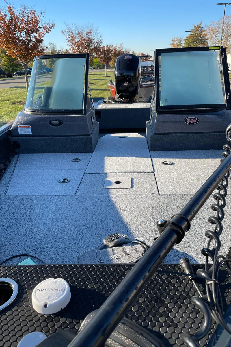 Slide: The Image of 2024 Ranger VS1782SC Reata fishing boat interior with dual consoles and motor. - 3