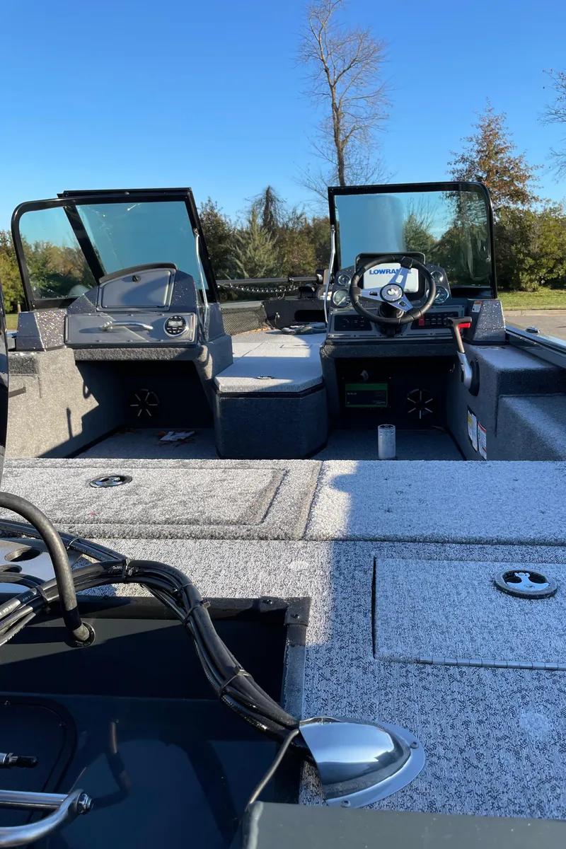 Slide: The Image of 2024 Ranger VS1782SC Reata boat interior with steering console and seating. - 5