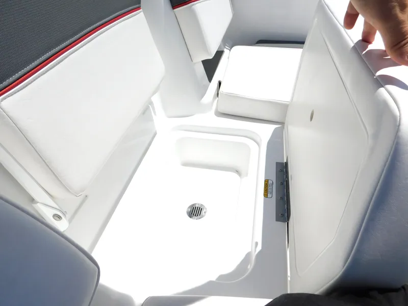Slide: The Image of 2024 Tahoe T18 boat with open storage compartment and white seating. - 26