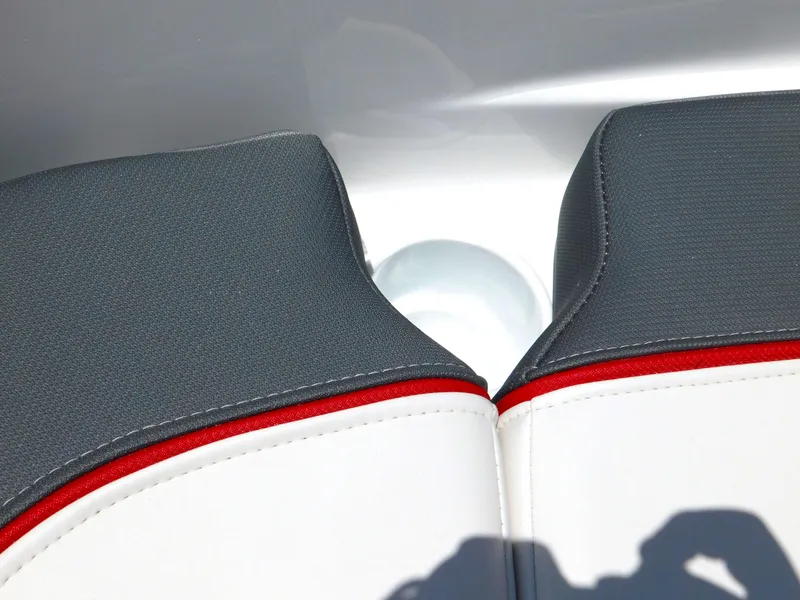 Slide: The Image of 2024 Tahoe T18 boat seat with gray and white upholstery, red accent. - 30
