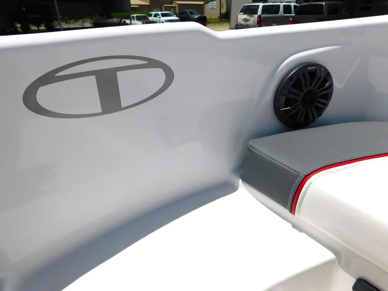 Slide: The Image of 2024 Tahoe T18 boat interior with speaker and seating. - 31