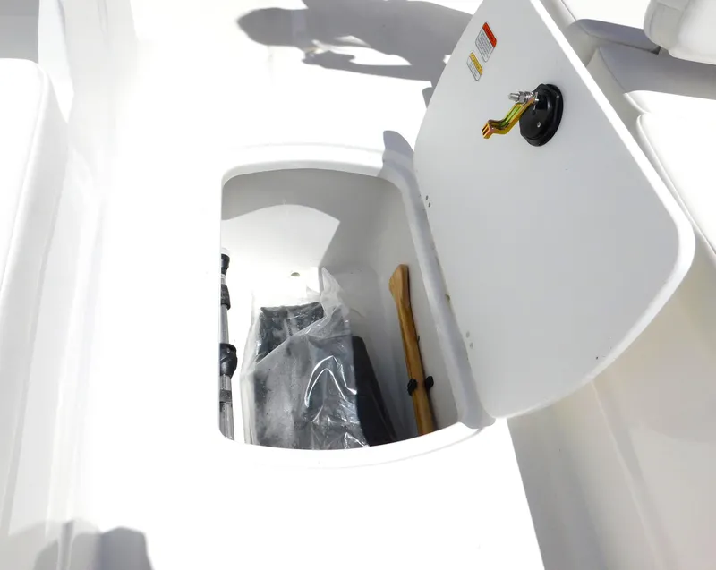 Slide: The Image of 2024 Tahoe T18 boat storage compartment with open lid. - 32