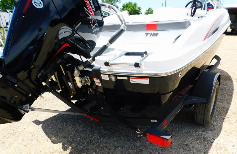 Slide: The Image of 2024 Tahoe T18 boat on trailer, rear view with outboard motor. - 35