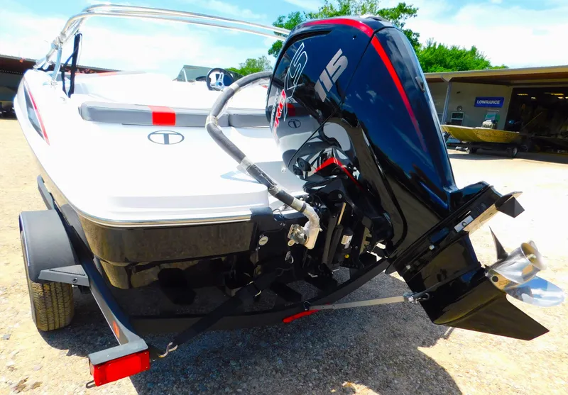 Slide: The Image of 2024 Tahoe T18 boat with outboard motor on trailer. - 36