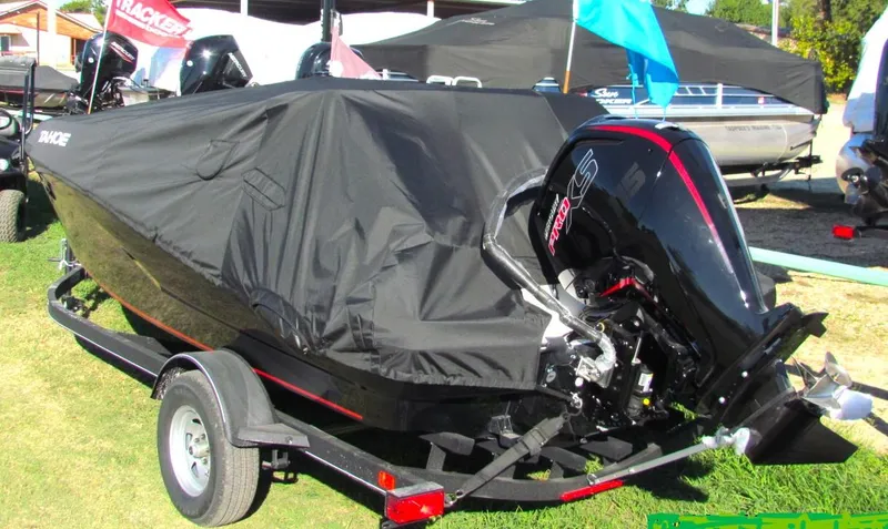 Slide: The Image of 2024 Tahoe T18 boat with cover on trailer, outdoor display. - 43