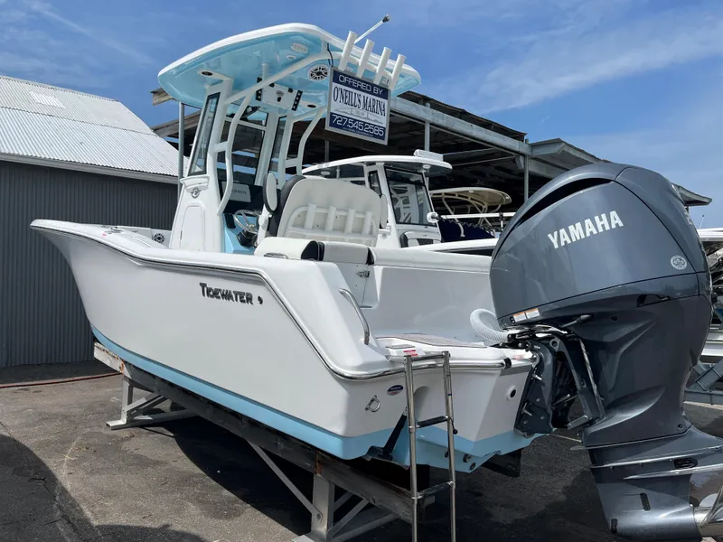 The Image of 2025 Tidewater 232 LXF boat with Yamaha engine in a marina. - 0