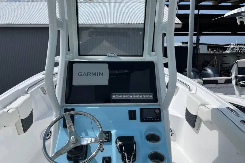 Slide: The Image of 2025 Tidewater 232 LXF boat console with Garmin navigation system. - 11