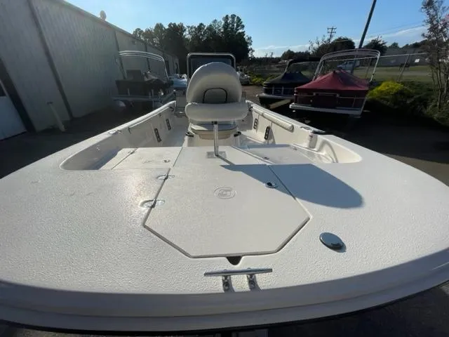 Slide: The Image of 2024 Carolina Skiff 19LS boat, front deck view, parked outdoors. - 2