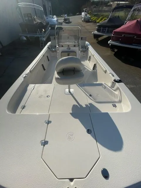 Slide: The Image of 2024 Carolina Skiff 19LS boat interior with seating and storage compartments. - 3