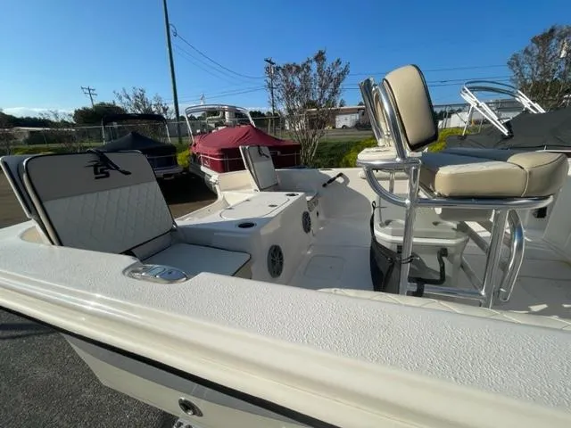 Slide: The Image of 2024 Carolina Skiff 19LS boat interior with seating and storage compartments. - 5