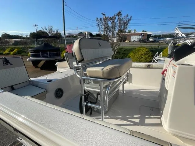 Slide: The Image of 2024 Carolina Skiff 19LS boat interior with seating and console. - 7