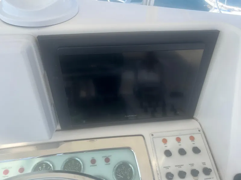 Slide: The Image of Cabo 35 Flybridge 2002 dashboard with gauges and controls. - 18