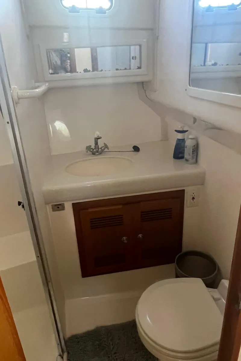 Slide: The Image of 2002 Cabo 35 Flybridge boat bathroom interior view. - 20