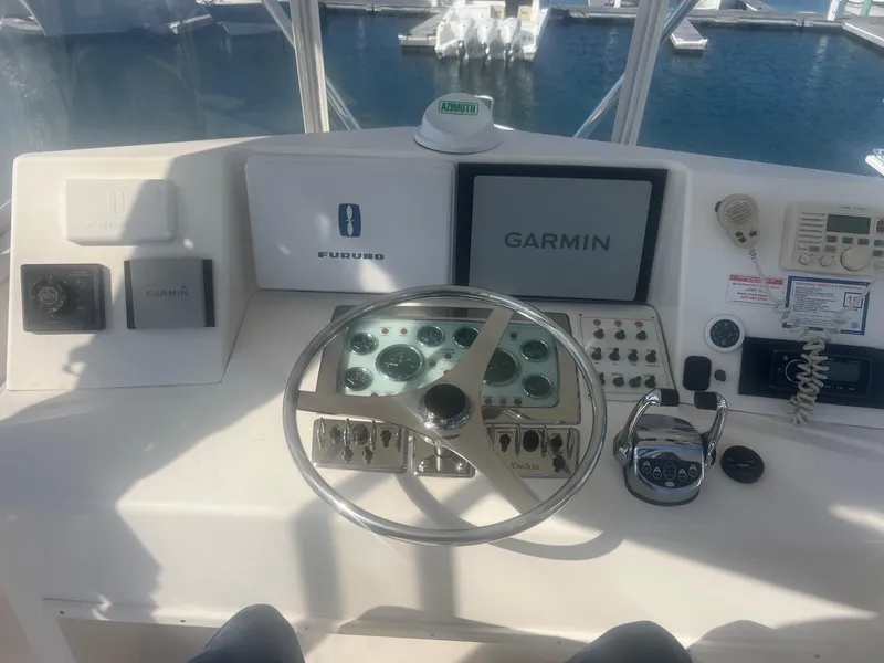 Slide: The Image of 2002 Cabo 35 Flybridge helm with Garmin and Furuno systems. - 5