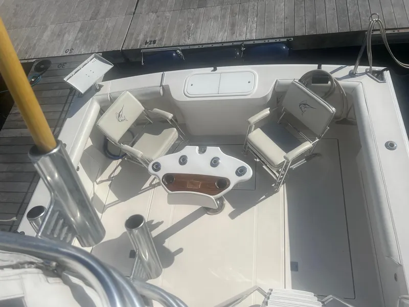 Slide: The Image of Cabo 35 Flybridge 2002, spacious cockpit with seating area. - 6