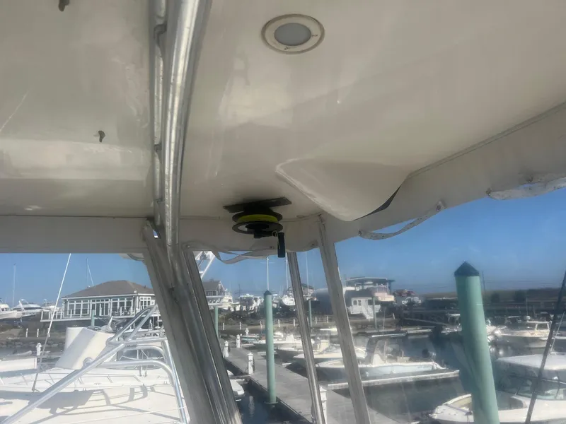 Slide: The Image of 2002 Cabo 35 Flybridge boat interior view at marina. - 7