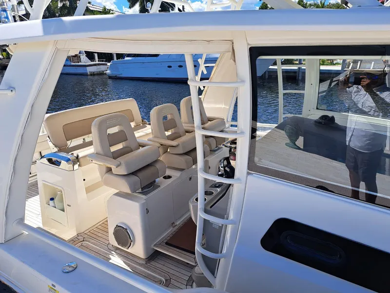 Slide: The Image of 2016 Boston Whaler 420 Outrage boat interior with seating and ladder. - 12