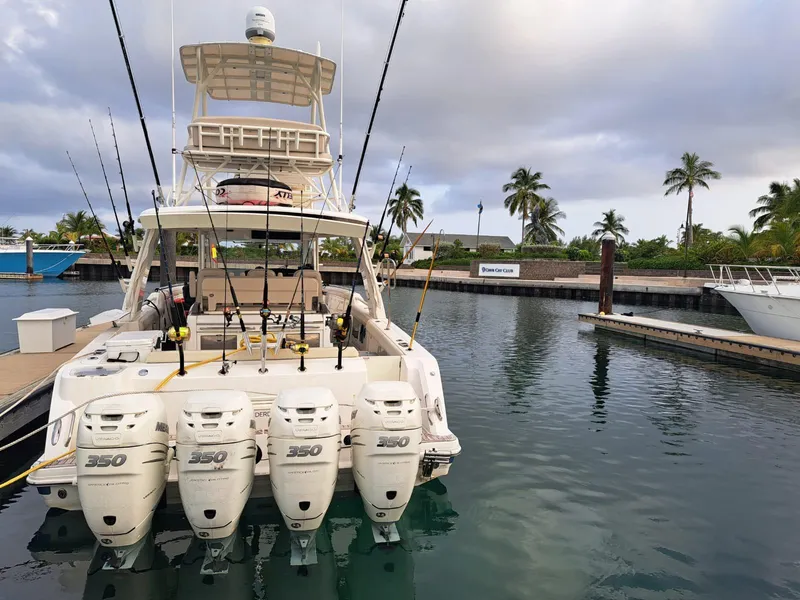 Slide: The Image of 2016 Boston Whaler 420 Outrage boat docked with four engines. - 24