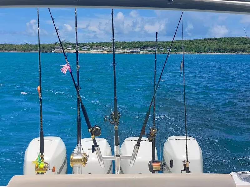 Slide: The Image of Fishing rods on a 2016 Boston Whaler 420 Outrage boat in blue ocean. - 28