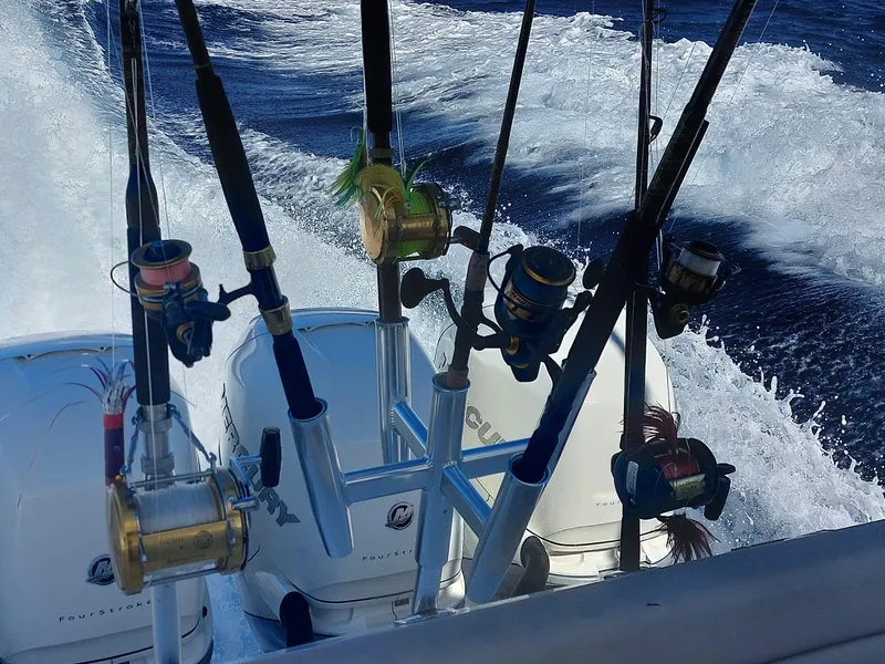 Slide: The Image of Fishing rods on a 2016 Boston Whaler 420 Outrage in action on the ocean. - 29